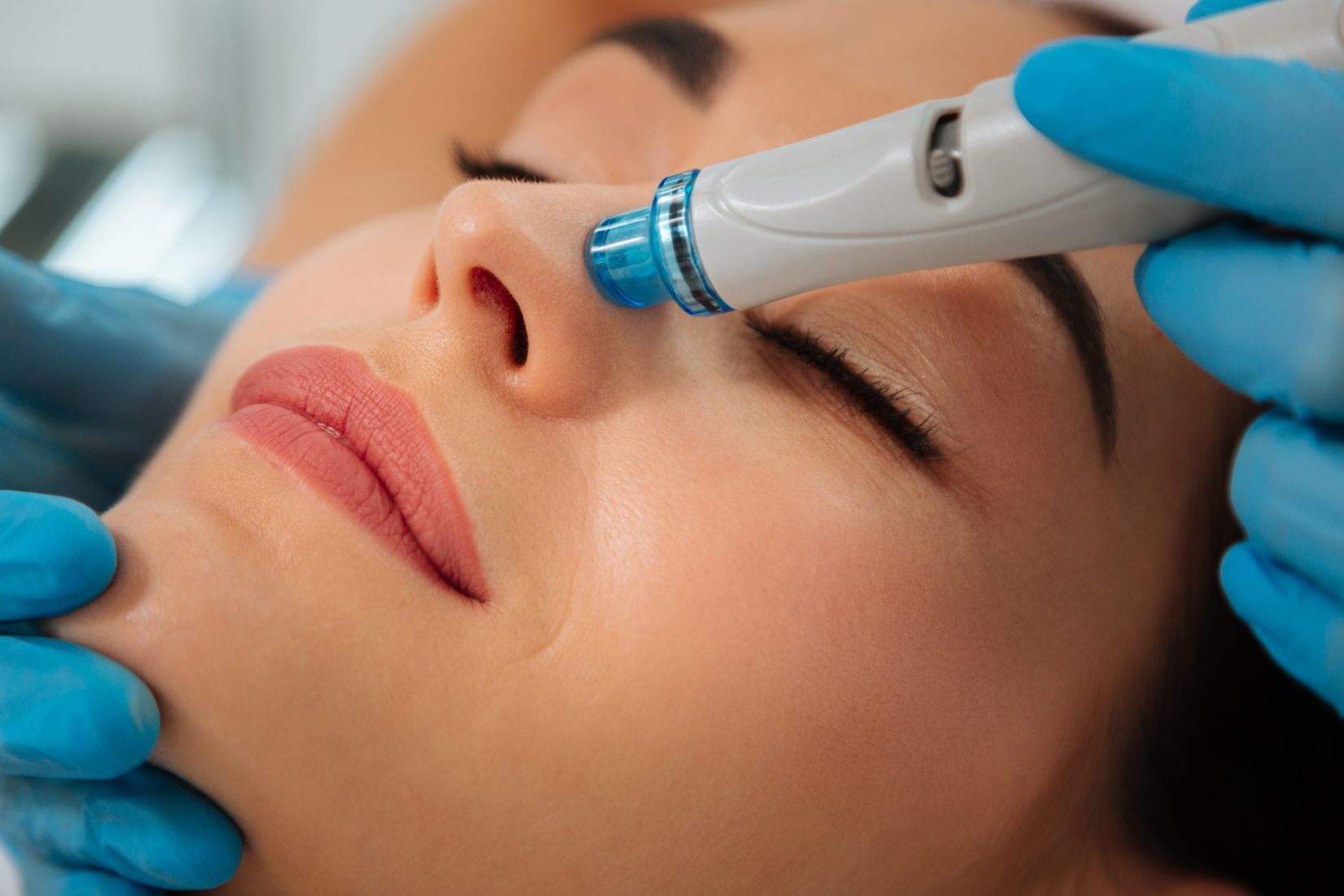 Close up of a modern device for hydrafacial procedure used for face cleansing